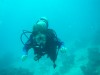 Laura diving on the Great Astrolobe Reef near Ono, Fiji